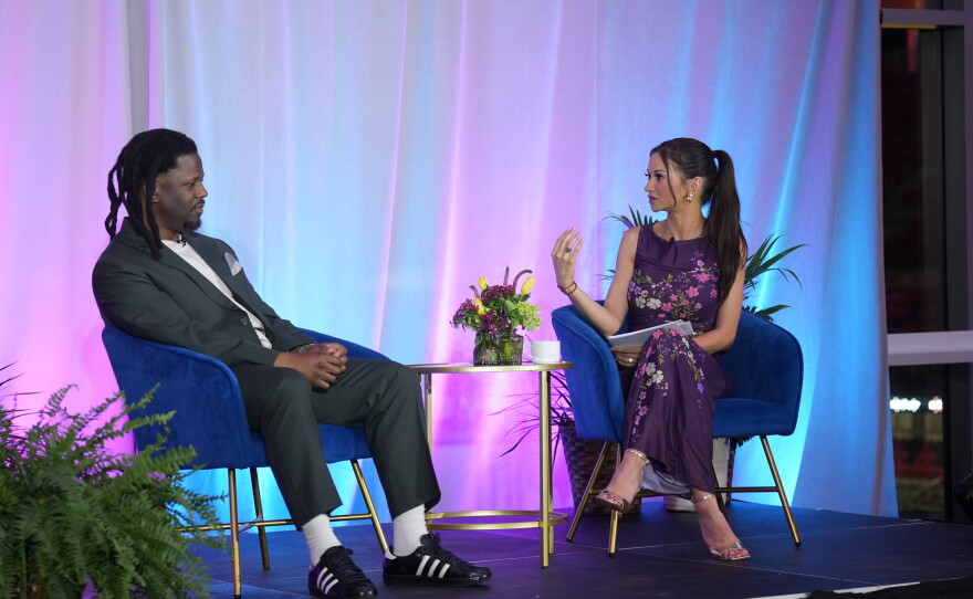 Saint Louis Public Radio newscaster Abby Llorico interviews NPR Tiny Desk host and producer Bobby Carter on stage at the 2026 Hear the Future gala.