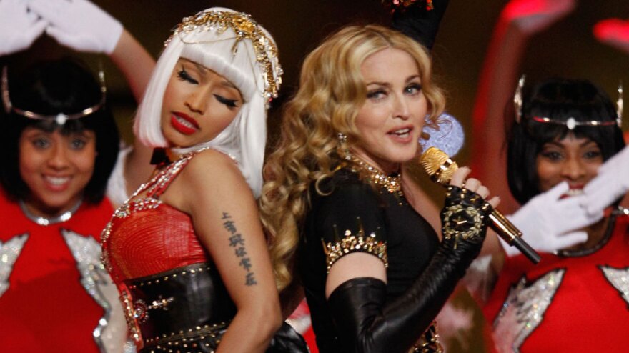 Nicki Minaj (left) and Madonna perform during the halftime show at the Super Bowl in February. In a song from Madonna's new album, <em>MDNA,</em> the two singers each play with traditionally feminine and masculine gender roles.