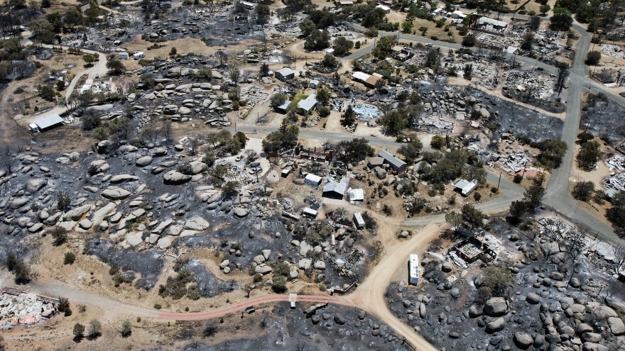 This aerial photo shows Yarnell, Ariz., days after a fire claimed the lives of 19 members of an elite firefighting crew.