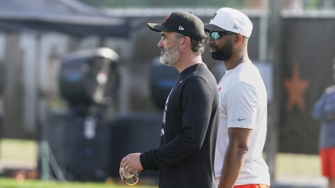 Cleveland Browns head coach Kevin Stefanski, left, and Andrew Berry, right, executive vice president, football operations and general manager, watch during a practice at the team's NFL football training camp Thursday, July 24, 2025, in Berea, Ohio. 