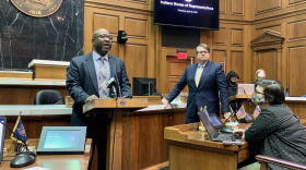Senate Minority Leader Greg Taylor (D-Indianapolis), at the lectern, and House Minority Leader Phil GiaQuinta (D-Fort Wayne), right, discuss the 2021 legislative session.