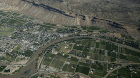 Overhead view of the Colorado River carving through the landscape.