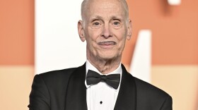 John Waters arrives at the Vanity Fair Oscar Party on Sunday, March 2, 2025, at the Wallis Annenberg Center for the Performing Arts in Beverly Hills, Calif. (Photo by Evan Agostini/Invision/AP)