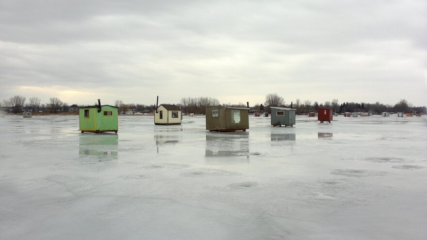 Ice fishing huts on ice.