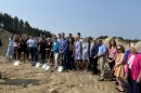Ceremony attendees celebrate breaking ground on a new net-zero housing development in Hudson. 