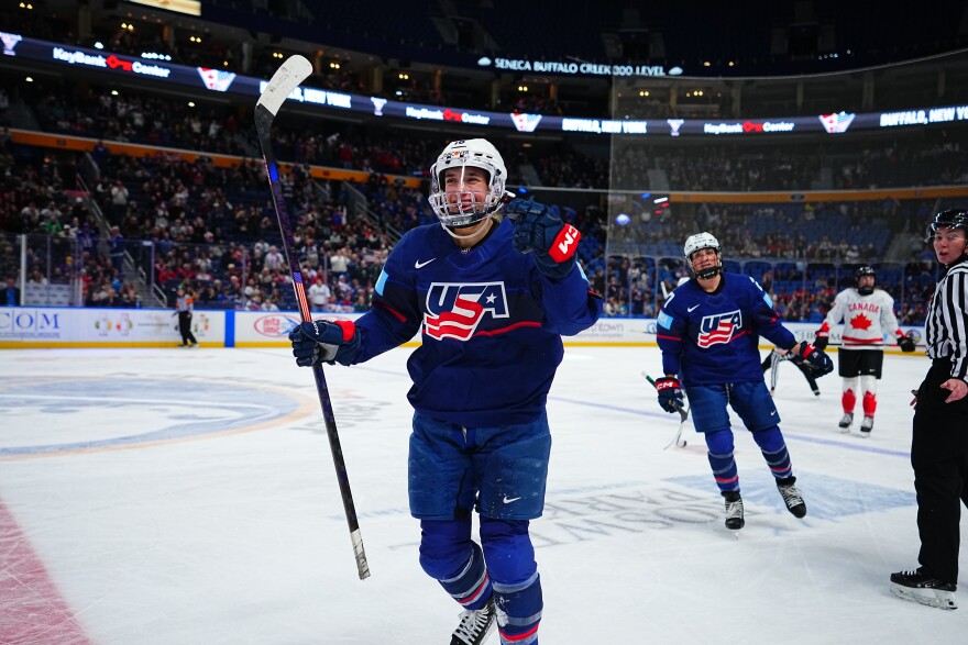 Hayley Scamurra celebrates on the ice while playing for Team USA. She'll be part of the US Women's National Team competing in February in the Winter Olympics in Italy.