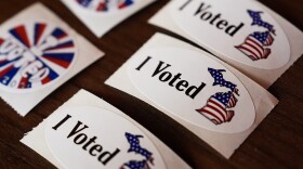 A close-up view of "I Voted" stickers on primary election day at the Baldwin Public Library, Tuesday, Aug. 4, 2026, in Birmingham, Mich. (AP Photo/Paul Sancya)