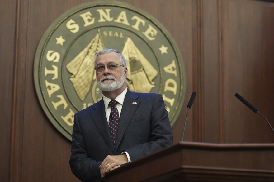 Florida Senate President Ben Albritton stands on the dais as he prepares to lead the opening senate session of the 2025 legislative session, Tuesday, March 4, 2025, at the state capitol in Tallahassee, Fla. 