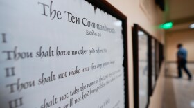 FILE - A copy of the Ten Commandments is posted along with other historical documents in a hallway of the Georgia Capitol, Thursday, June 20, 2024, in Atlanta. (AP Photo/John Bazemore, File)