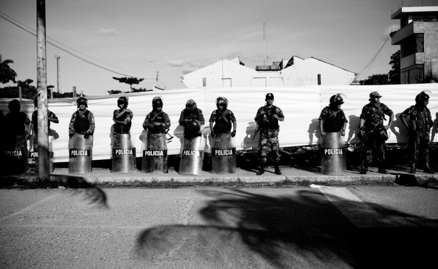 Police line the streets during a miners protest against regulation in April 2010.