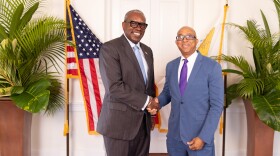 Pictured: Governor Albert Bryan Jr and IRB Director Joel Lee