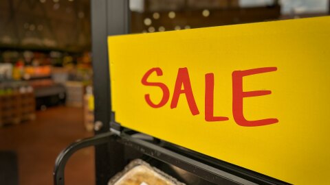 A sale sign marks discounted grocery items in Salt Lake City, July 28, 2026. Economists say rising prices for essentials have contributed to ongoing concerns about affordability, even as Utah's economy continues to outperform many states.