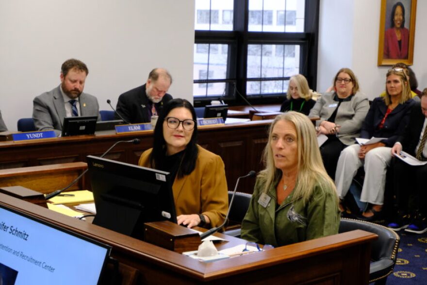 Lisa Parady (left) director of the Alaska Council of School Administrators and Jennifer Schmitz (right) director of the Alaska Educator Recruitment and Retention Center testify to a joint session of the House and Senate Education Committees on Mar. 30, 2026.