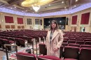 Rosemary Gill, president and CEO of the Zeiterion, stands among drop cloths and tools at the back of the main auditorium. The historic Zeiterion theater in New Bedford is reopening after a two-year, $37 million renovation. Images from Jan. 6, 2026 — 11 days before the opening show.