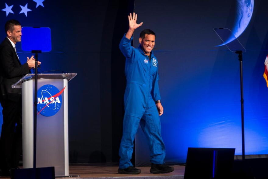 Artemis III crew member Frank Rubio waves to the crowd during a press conference at Johnson Space Center on Tuesday, June 9, 2026, in Houston. (Annie Mulligan/AP)