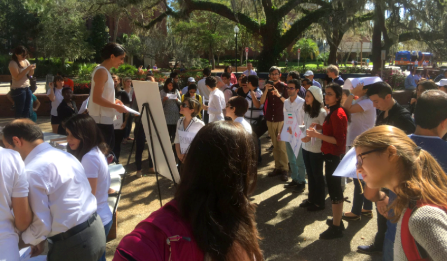 Over 50 students gathered in Turlington Plaza on the UF campus Thursday, February 9, 2017 to protest President Trump's travel ban from seven Muslim-dominant countries. (Danielle Ball/WUFT News)