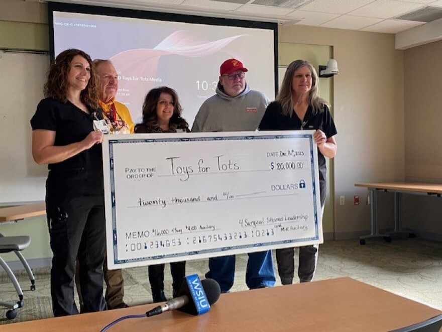 SIH and the Memorial Hospital of Carbondale Auxiliary present local organizers of Toys for Tots a check for donations to the toy drive.