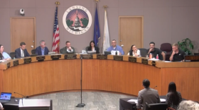 Lansing city council members in a meeting setting.