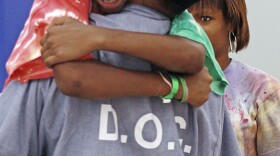 In the Father to Child Summer Camp Behind Bars program, kids can bond with their fathers while staying at a campground near prison.  Geray Williams, an inmate at the North Branch Correctional Institution in Cumberland, Md., gets a hug from his son Sanchez during the weeklong camp in 2010.