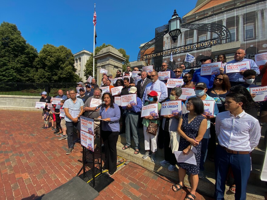 Roxana Rivera, president of 32BJ SEIU Local 615, in front of the Massachusetts Statehouse during a press conference hosted by Community Labor United.