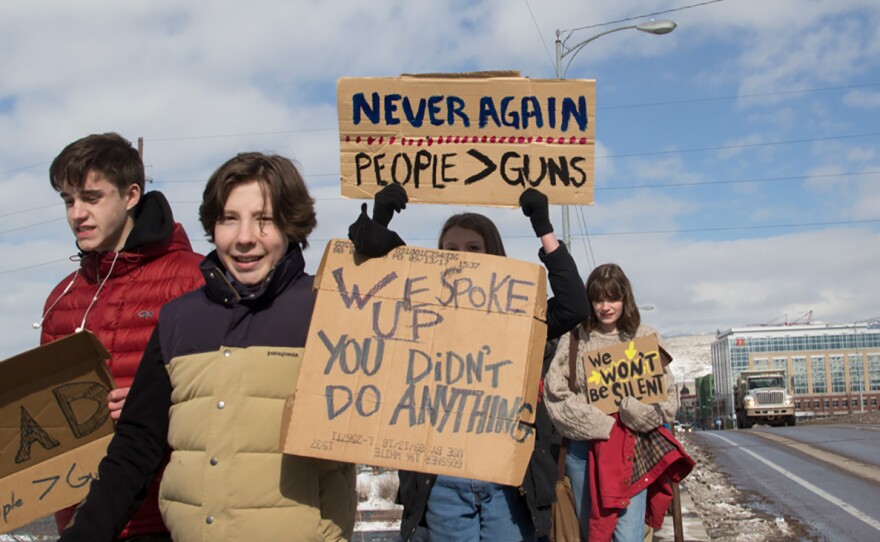 Missoula high school students march for action on gun safety on the Higgins Street bridge in Missoula, February 21, 2018.