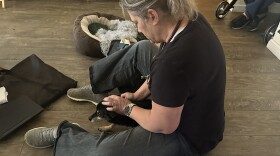 Veterinarian Renée Bufkin from Vet to Pet visits a client in his home to check on his 18 years old chihuahua mix breed.