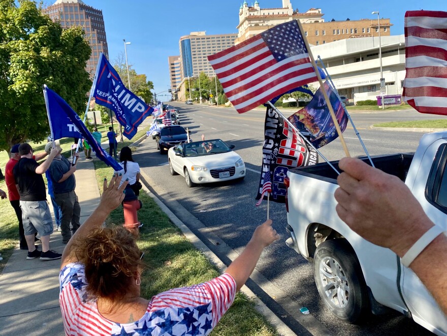 The line of cars carrying Trump supporters stretched down Main Street on Saturday afternoon.