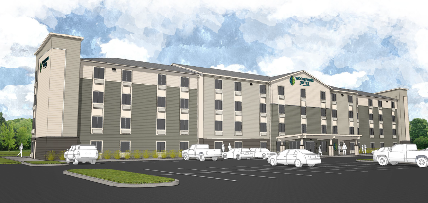 A rendering shows the proposed Woodspring Suites extended-stay hotel to be built at 1180 Jefferson Road in Henrietta.
