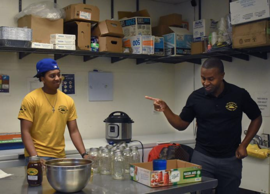 Benjamin Ruffin helps Rexroy Scott prep Jerk Sauce on Feb. 7 at Jamaican Jerk Hut in Columbia. Ruffin has worked at Jamaican Jerk Hut for four years and is about to leave for college, but Scott says he is always welcome to come back.