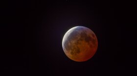 The moon passes through Earth's shadow on Sunday night, Jan. 20, 2019.