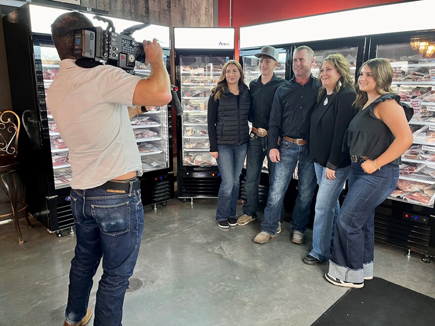 Videographer Josh Kletzkin shoots footage of the Herman family for a TV commercial at Montana Prime Meats