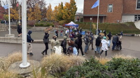A group of protesters march into the EMU Amphitheater at the University of Oregon to protest the Turning Point USA debate event with Alex Stein, Oct. 28, 2026.