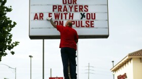Jiffy Lube employee Ralph Nieves put up a sign of support for the Orlando community
following the shooting at the Pulse nightclub last Saturday night on June 16, 2016 in Orlando, Florida. (Spencer Platt/Getty Images)