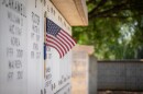 Miniature flag on grave at Fort Sam Houston National Cemetery on May 23, 2025.\