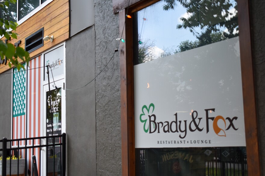 A close up shot of a restaurant window with a logo printed on it.