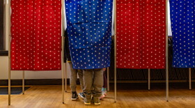 Brian Johnson and his children Reid, 9, and Sage, “Almost seven,” vote together at Newfields Town Hall during the New Hampshire Primary.