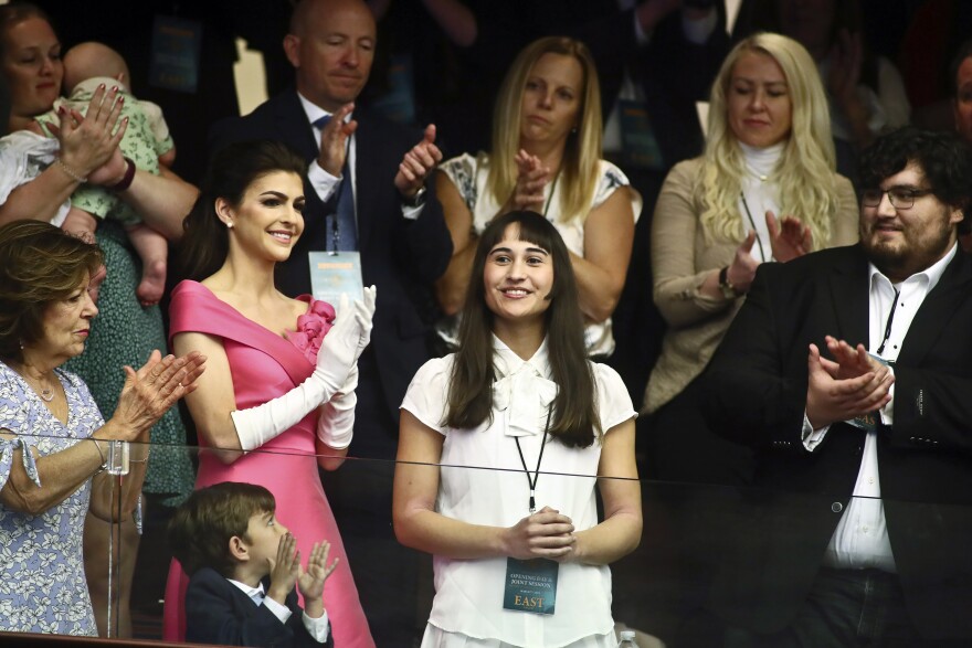 Chloe Cole, center, is recognized by Florida Gov. Ron DeSantis during a joint session for his State of the State speech Tuesday, Mar. 7, 2023 at the Capitol in Tallahassee, Fla. At left, is Florida first lady Casey DeSantis. Cole received puberty blockers when she was 13, and underwent a double mastectomy at 16. Now she is an advocate against allowing those procedures on children.
