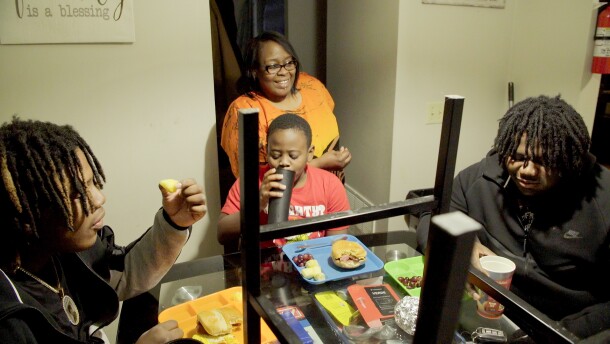 During breakfast Tuesday morning, March 17, Teresa Flax chats (from left) with sons Joseph Brown Jr. ,17, De'len Flax, 9, and nephew Christopher Brown, 17, in the dinette of their Evansville townhome. The rent cost is income-based as part of the Evansville Housing Authority. Flax was also introduced to a program she said changed her life — the Indiana Family Self-Sufficiency program.