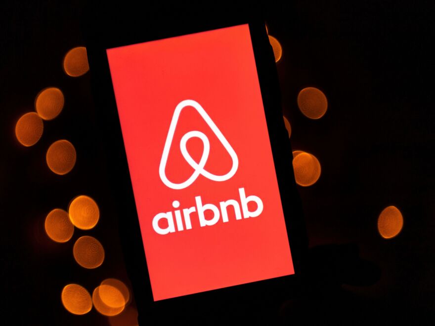 This illustration picture taken on November 22, 2019, shows the logo of the online lodging service Airbnb displayed on a smartphone in Paris. (Photo by Lionel BONAVENTURE / AFP) (Photo by LIONEL BONAVENTURE/AFP via Getty Images)