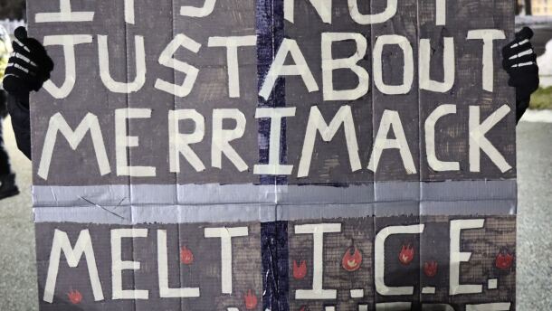 Protestor in Merrimack, where the federal government has plans to convert a warehouse into an immigrant detention facility.
