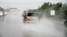 Drivers on the freeway in Salt Lake City, kicking up water during the heavy rain, May 6, 2014.