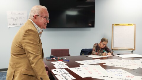 Adam Urbanski, RTA President, talks with union members who gathered to make posters to protest the RCSD contract with Oracle that has crated a payroll crisis for hundreds of teachers and support staff who are yet to be paid, paid correctly, paid on time, or have correct payroll deductions made. Union members gathered a the Rochester Teachers Association union offices to make the signs ahead of Thursdays action Infront of districts offices to protect the payroll isssues.