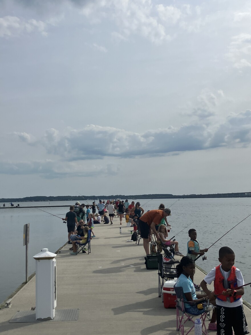 Kids and their helpers crowded along Long Warf piers, vying to catch the biggest fish