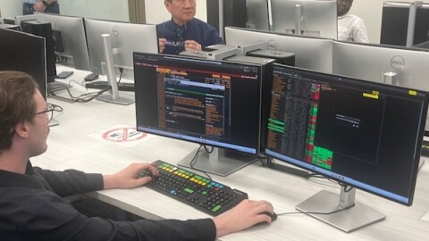 Student Chase Hickey works at a Bloomberg Terminal at the UIS College of Business and Management.