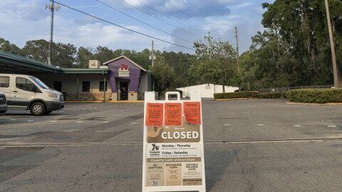 A sign outside the Humane Society of North Central Florida announced that all of its animals had been placed in foster homes as smoke from a nearby wildfire lingered over Gainesville on April 19. The shelter evacuated 40 dogs and 18 cats that day.
