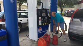 Stephen Maynard, a city of Alachua resident and Duke Energy Florida customer, fills up gas cans Tuesday for his generators, which he has been using for power after Hurricane Irma. Duke expects to have power back for most of its coverage area by this weekend. (Madeline Harlow/WUFT News)