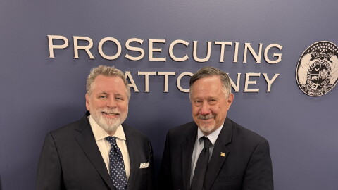 Platte County prosecutor Eric Zahnd, left, receives the Distinguished Prosecutor Award from the National District Attorneys Association in 2025. 