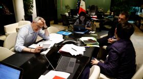 In Paris, French Economy and Finance Minister Bruno Le Maire (left) speaks on the phone with his German counterpart as his advisor Juliette Oury (center) and cabinet deputy director Thomas Revial (second right) and French Treasury director Odile Renaud-Basso attend, during a break in a videoconference meeting of European Union finance ministers to discuss coronavirus response on April 7.