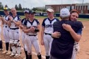 Abington Heights Coach John Kelly hugs pitcher Adrianna Condrad during the silver medal ceremony on Thursday.