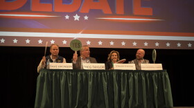 All four gubernatorial candidates were unsure how to answer one of the yes/no paddle questions during a fisheries debate in Kodiak on Sept. 9, 2026.